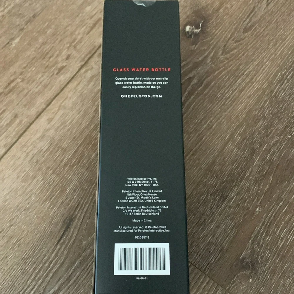 Peleton New Glass Water Bottle with Black Silicon Wrap 16 Oz capacity. - Picture 2 of 2